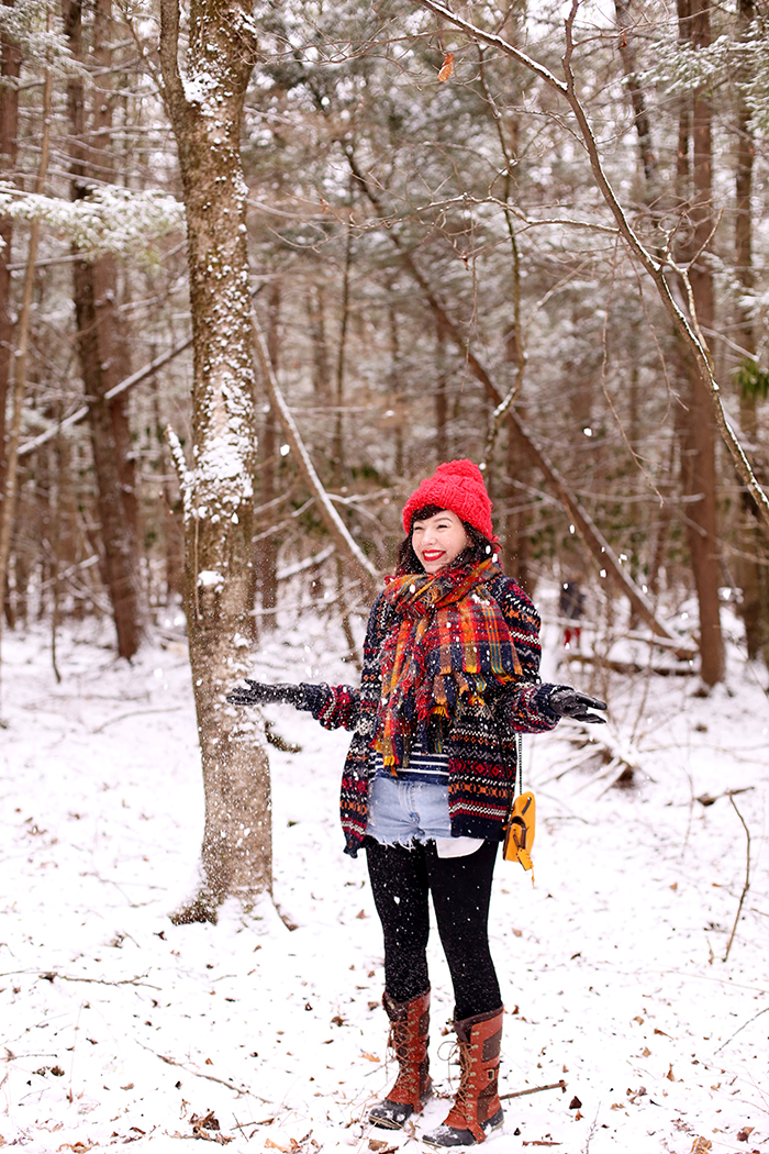 Evelyn Bourdon winter outfit sorel boots plaid scarf and fair isle sweater 2