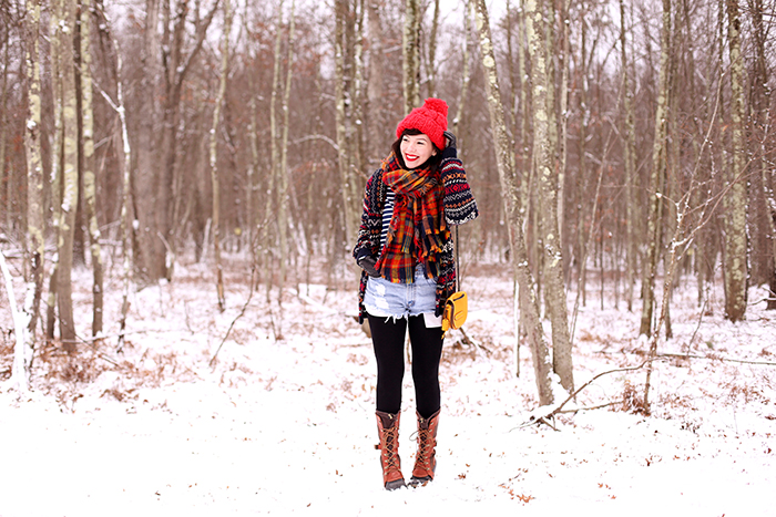 Evelyn Bourdon winter outfit sorel boots plaid scarf and fair isle sweater