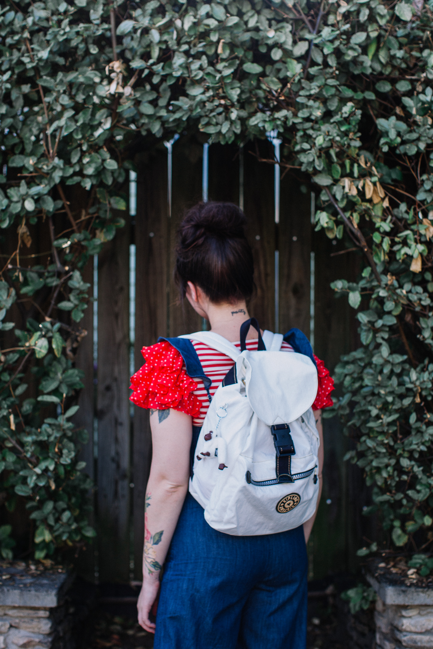 express ruffled jumpsuit and kipling backpack