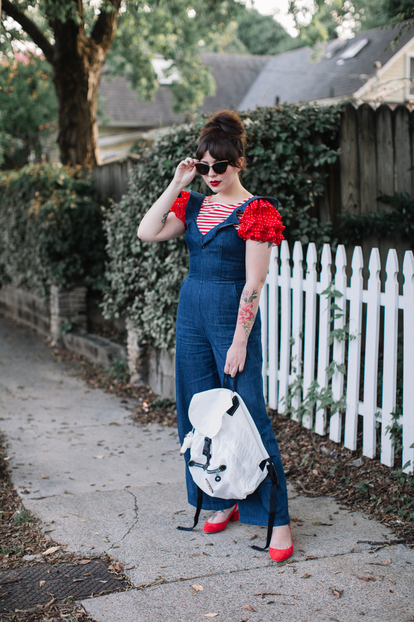 express ruffled jumpsuit and kipling backpack