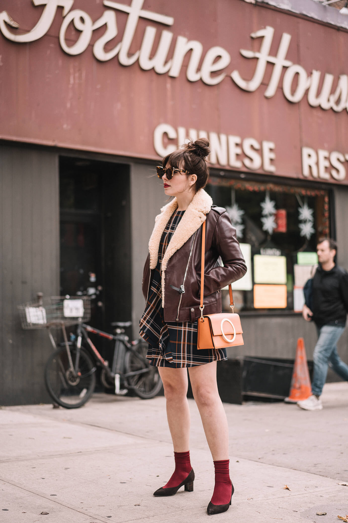 woman wearing leather jacket, dress, and Sarah flint emma pumps