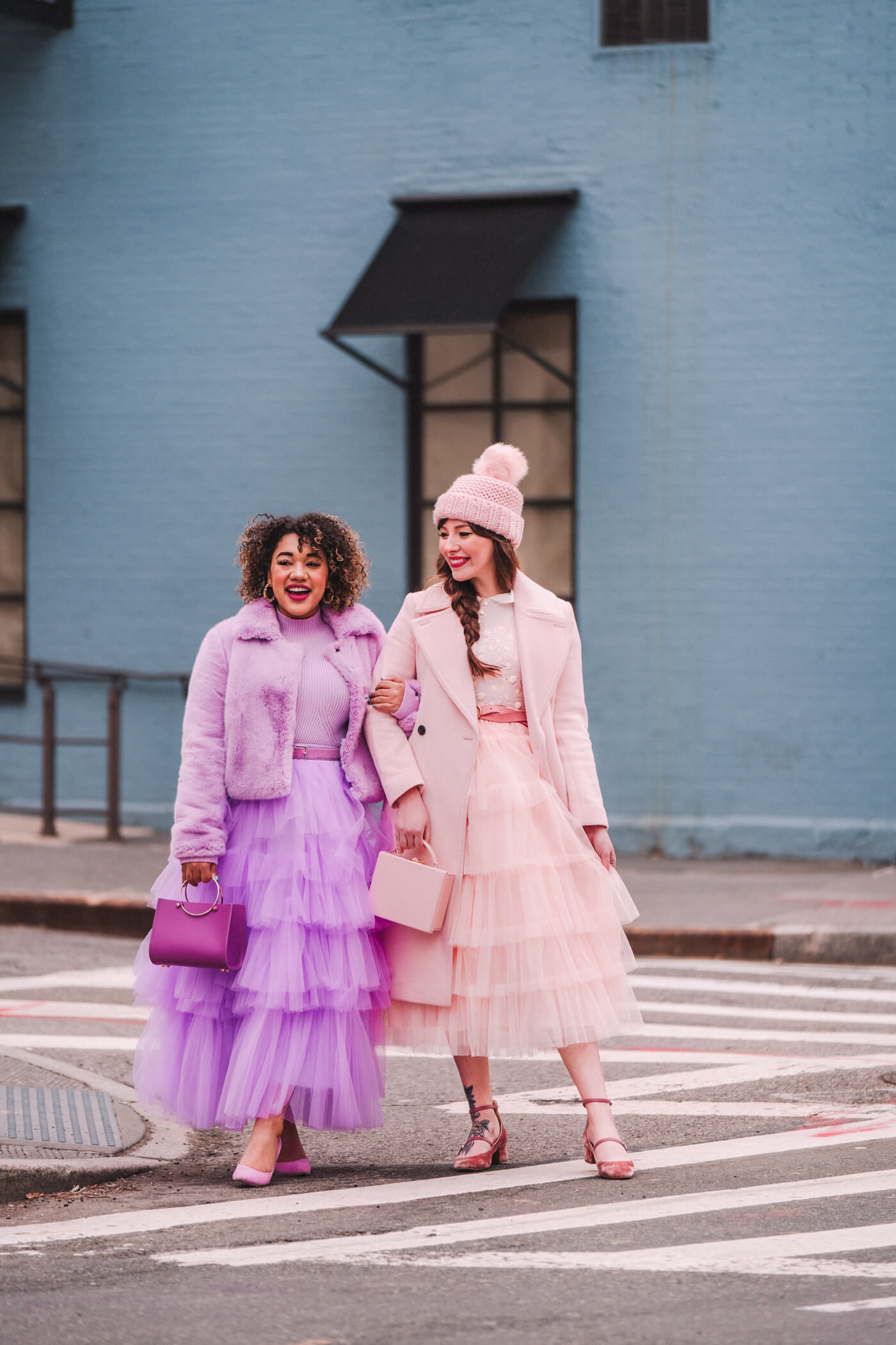 two women in pastel dresses sharing brighten up the room