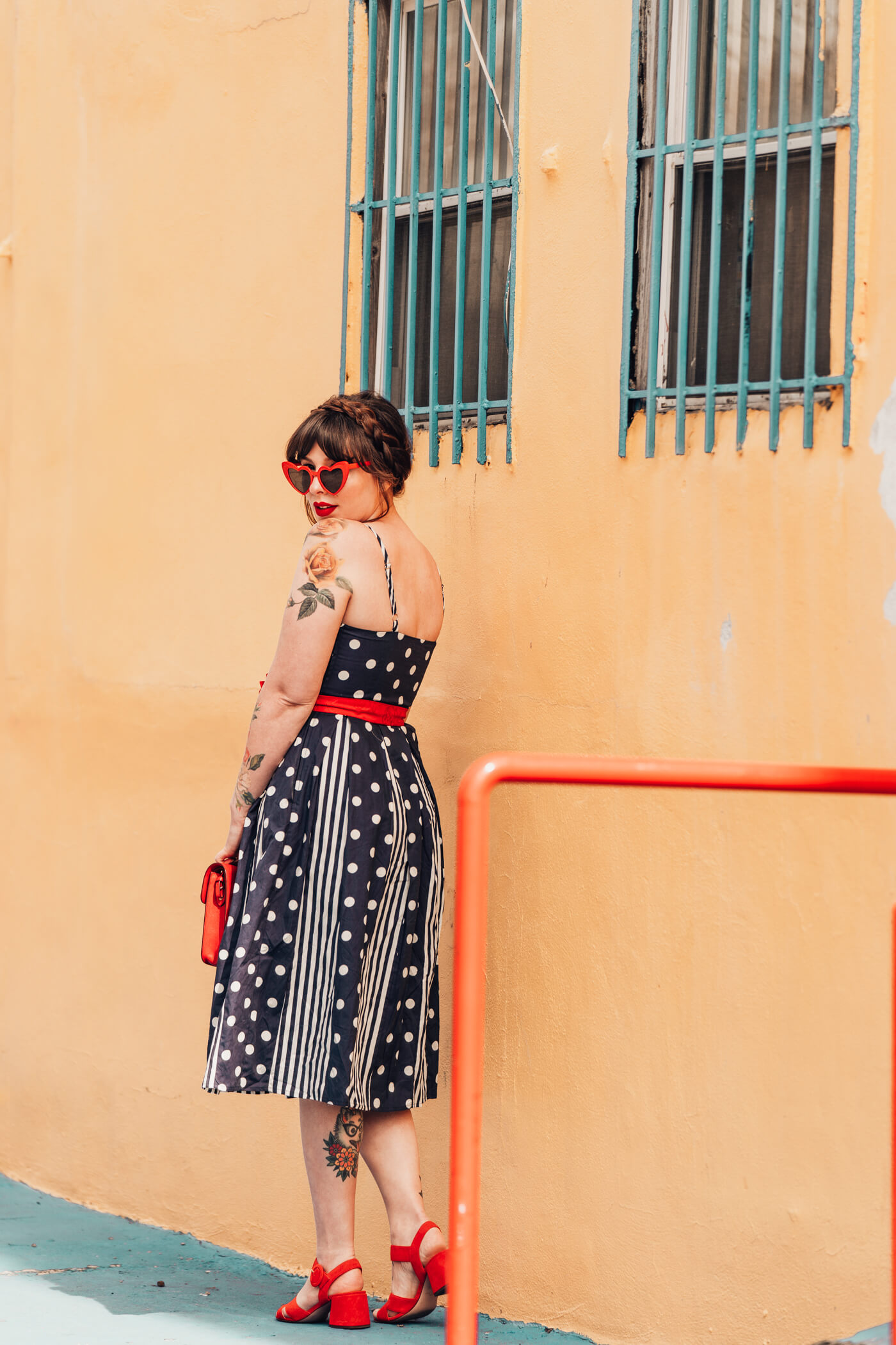 woman in polka dots dress and sharing against the current 