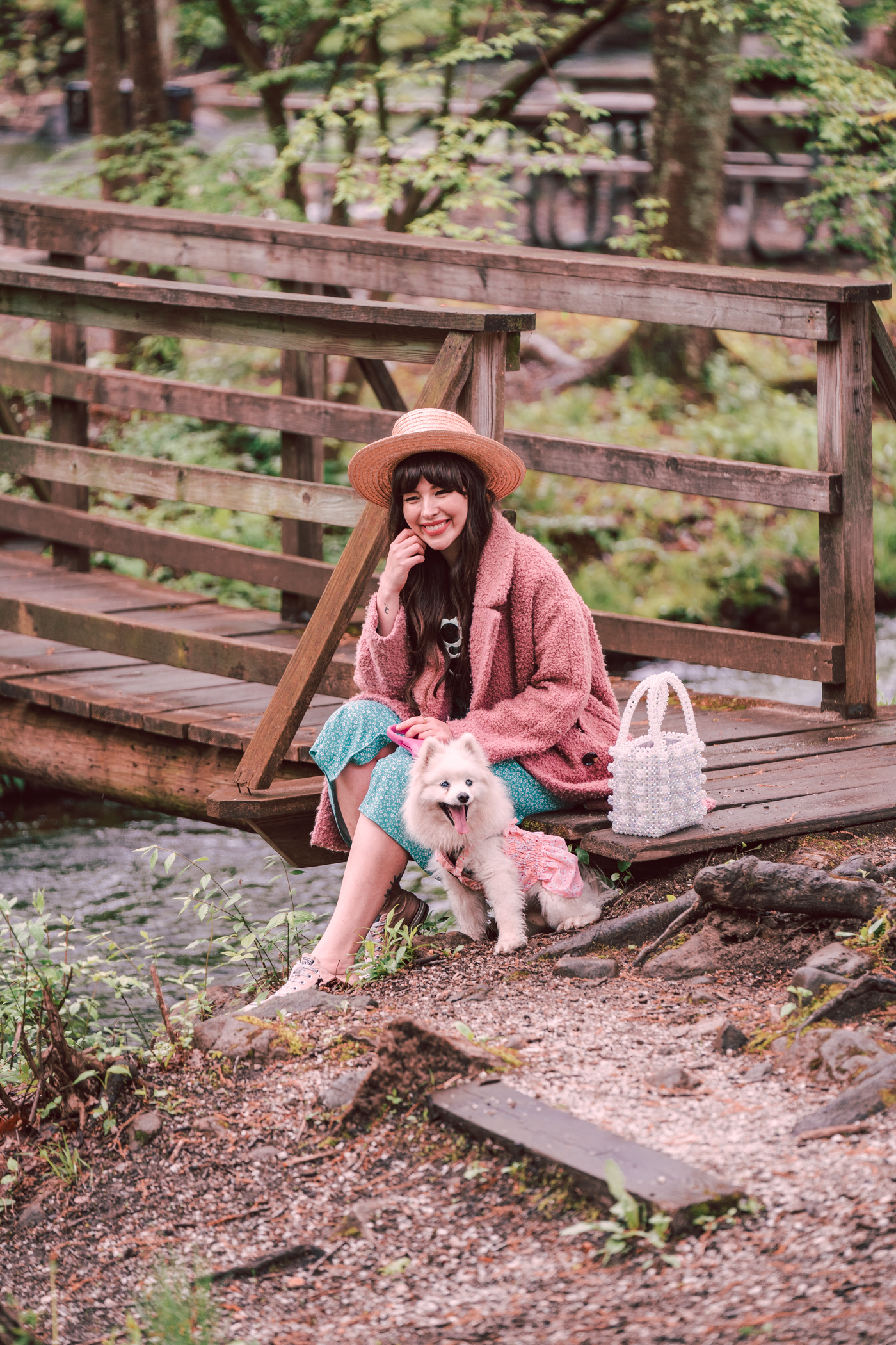 woman in the outdoors with her dog