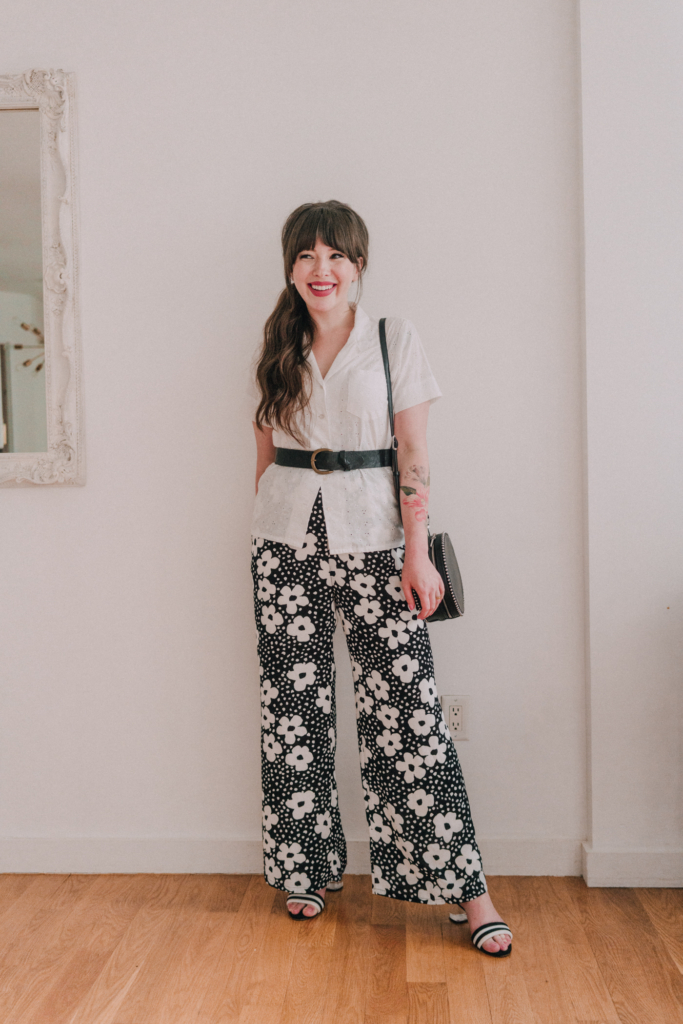 woman wearing white top and floral pants