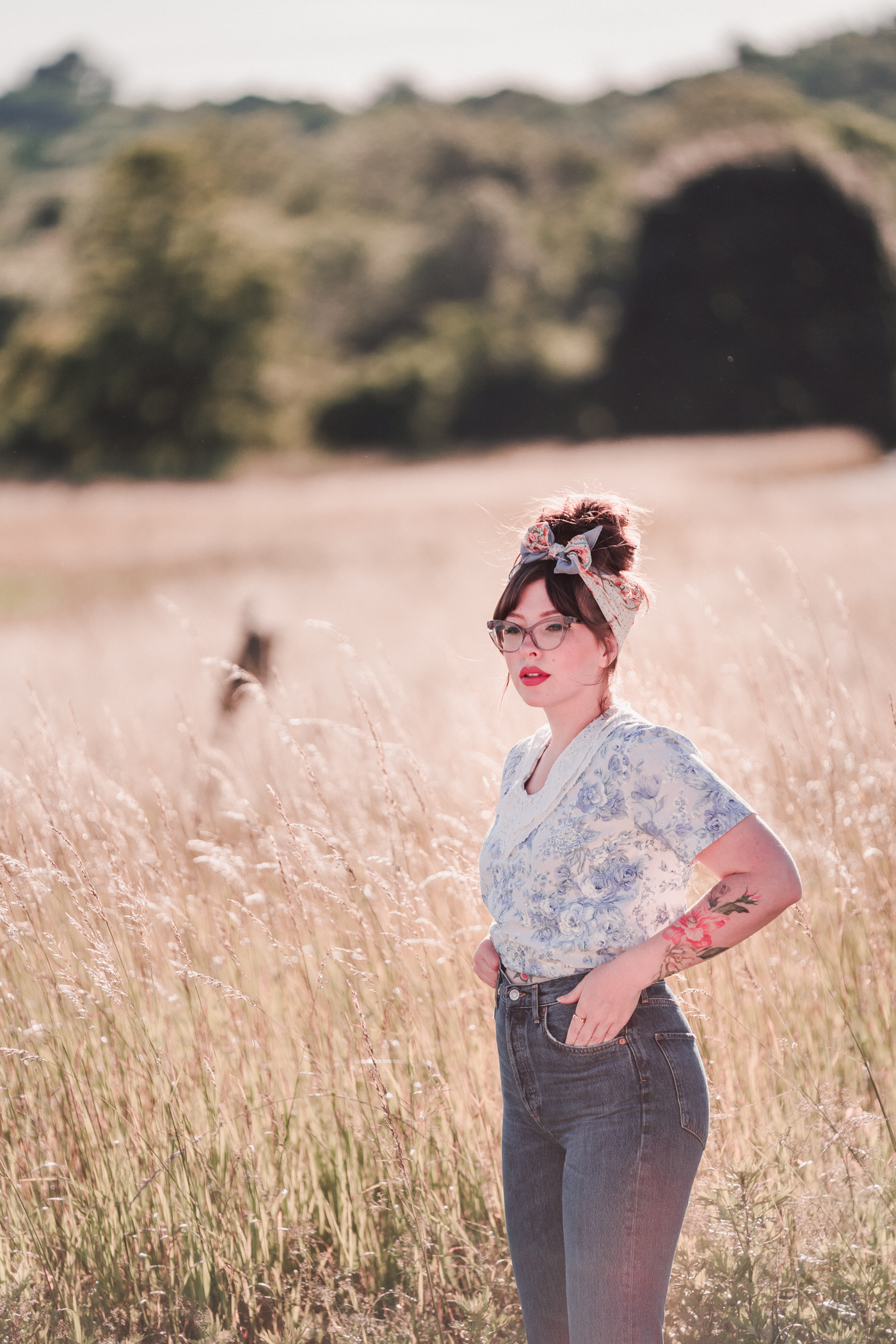 woman wearing jeans and floral top to share something new