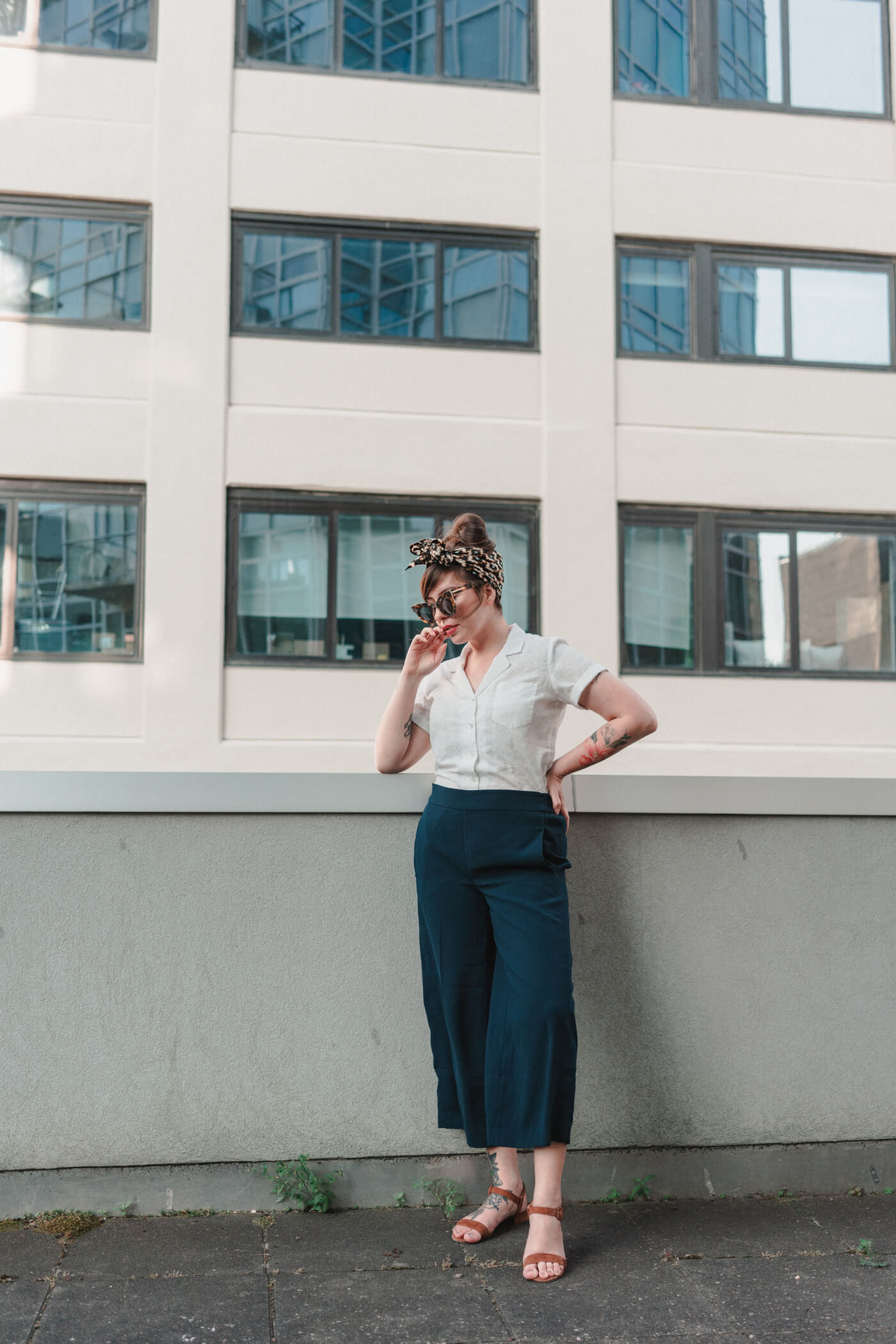 woman wearing white shirt and blue cullots 