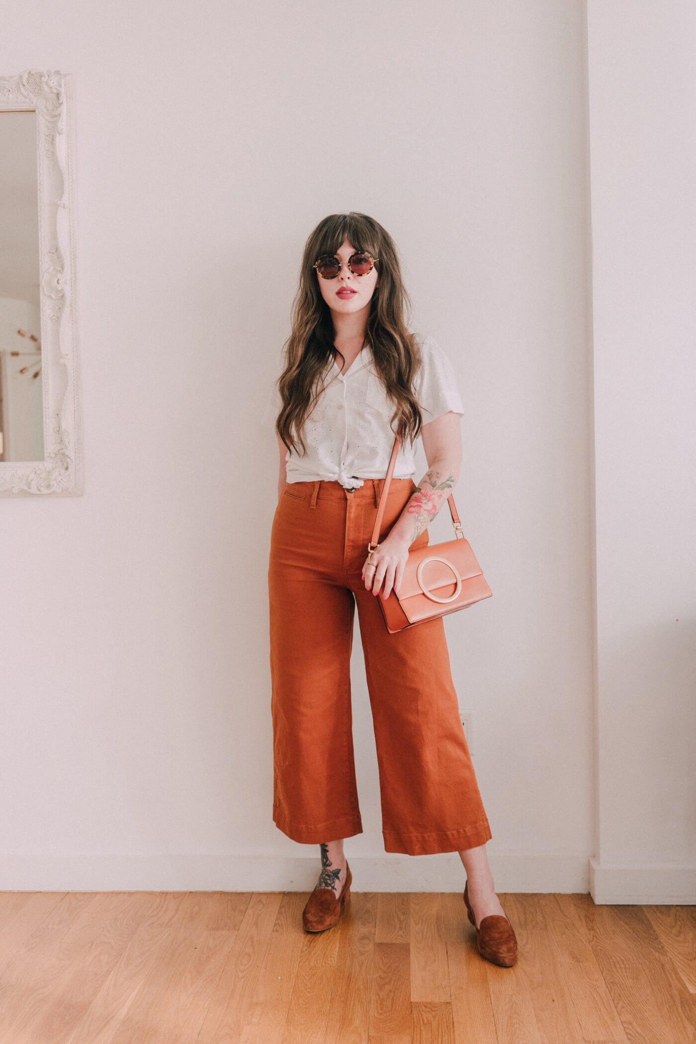 woman wearing white shirt and orange pants