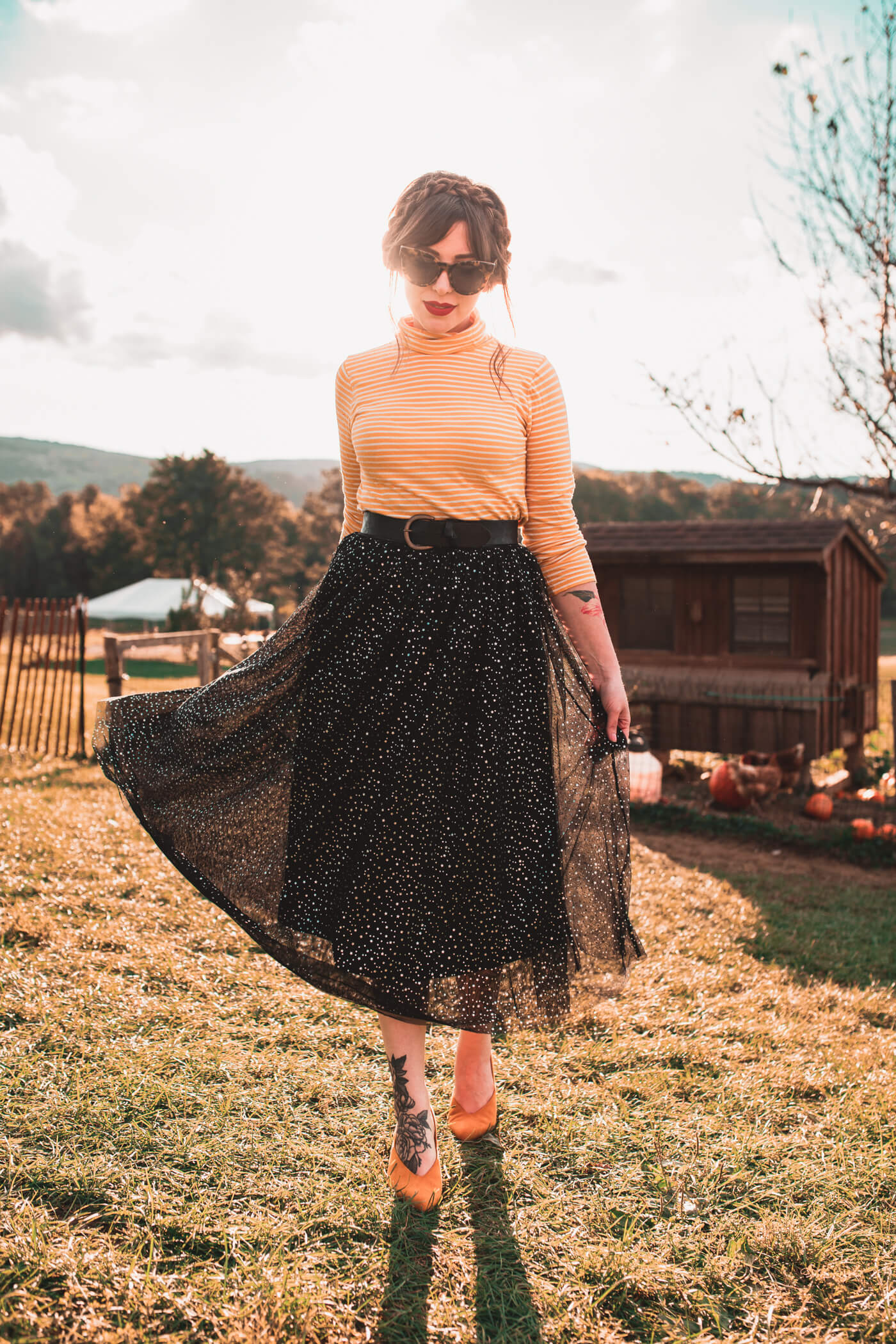 woman wearing black skirt, yellow top,. and yellow shoes