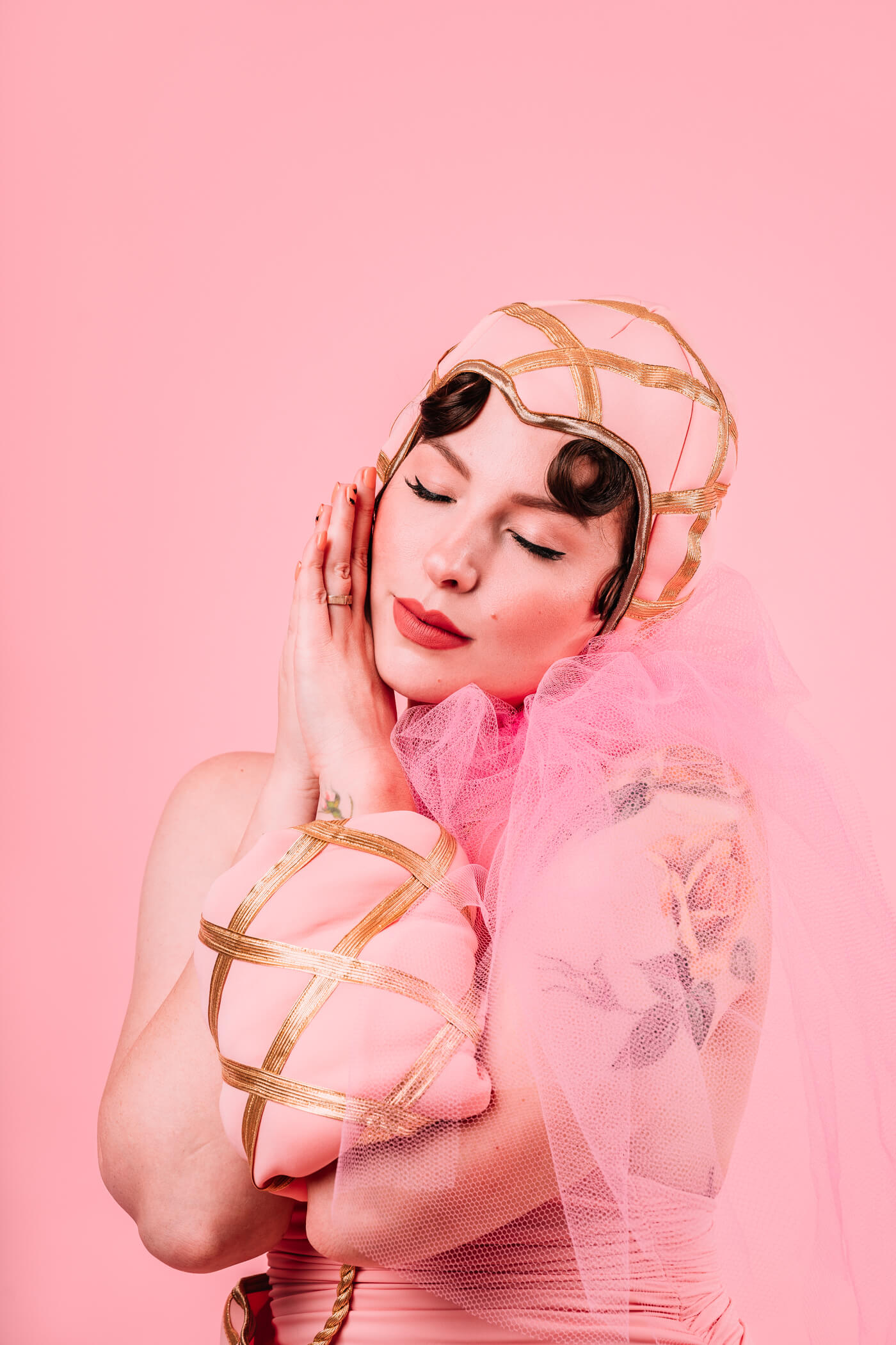 woman resting her head on her hands while wearing Singin' In The Rain Costume