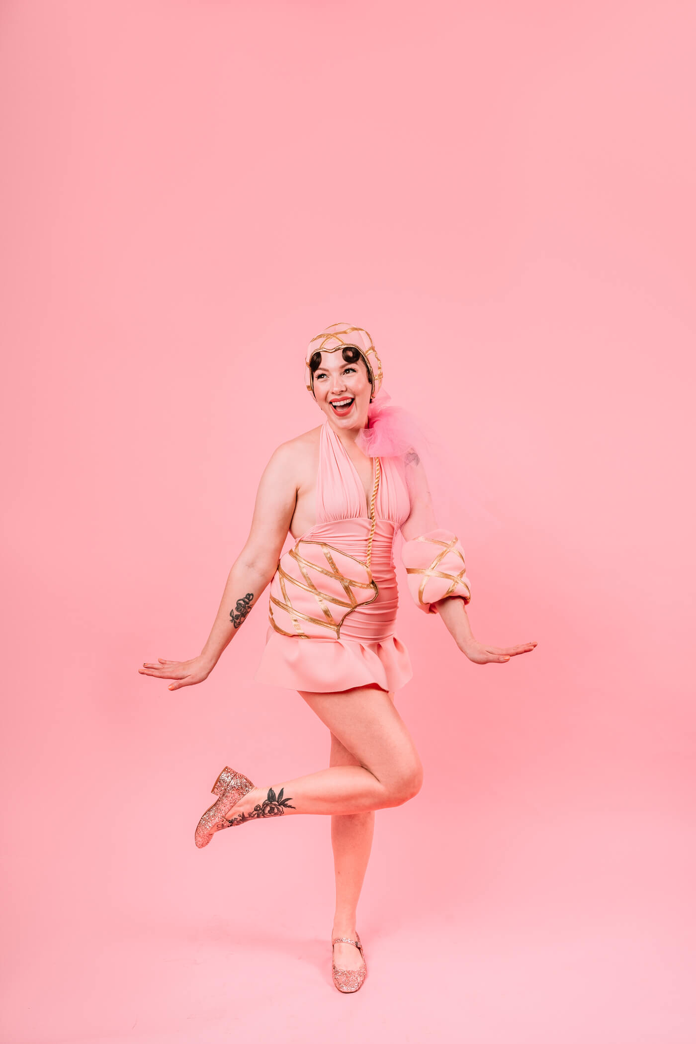 woman smiling and dancing wearing Singin' In The Rain Costume