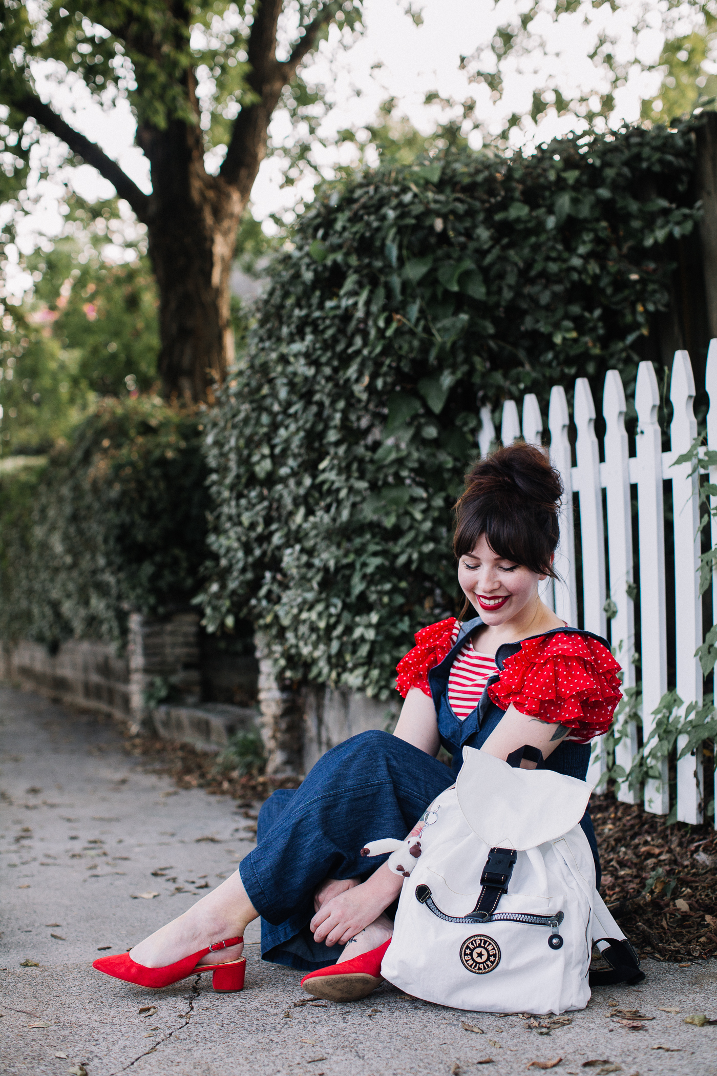 express ruffled jumpsuit and kipling backpack