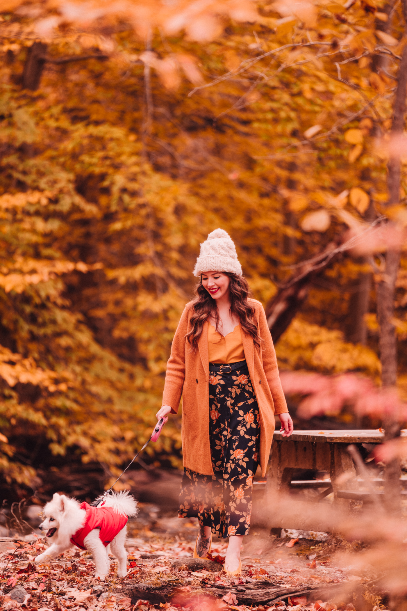 woman sharing Florals and Foliage and walking her dog