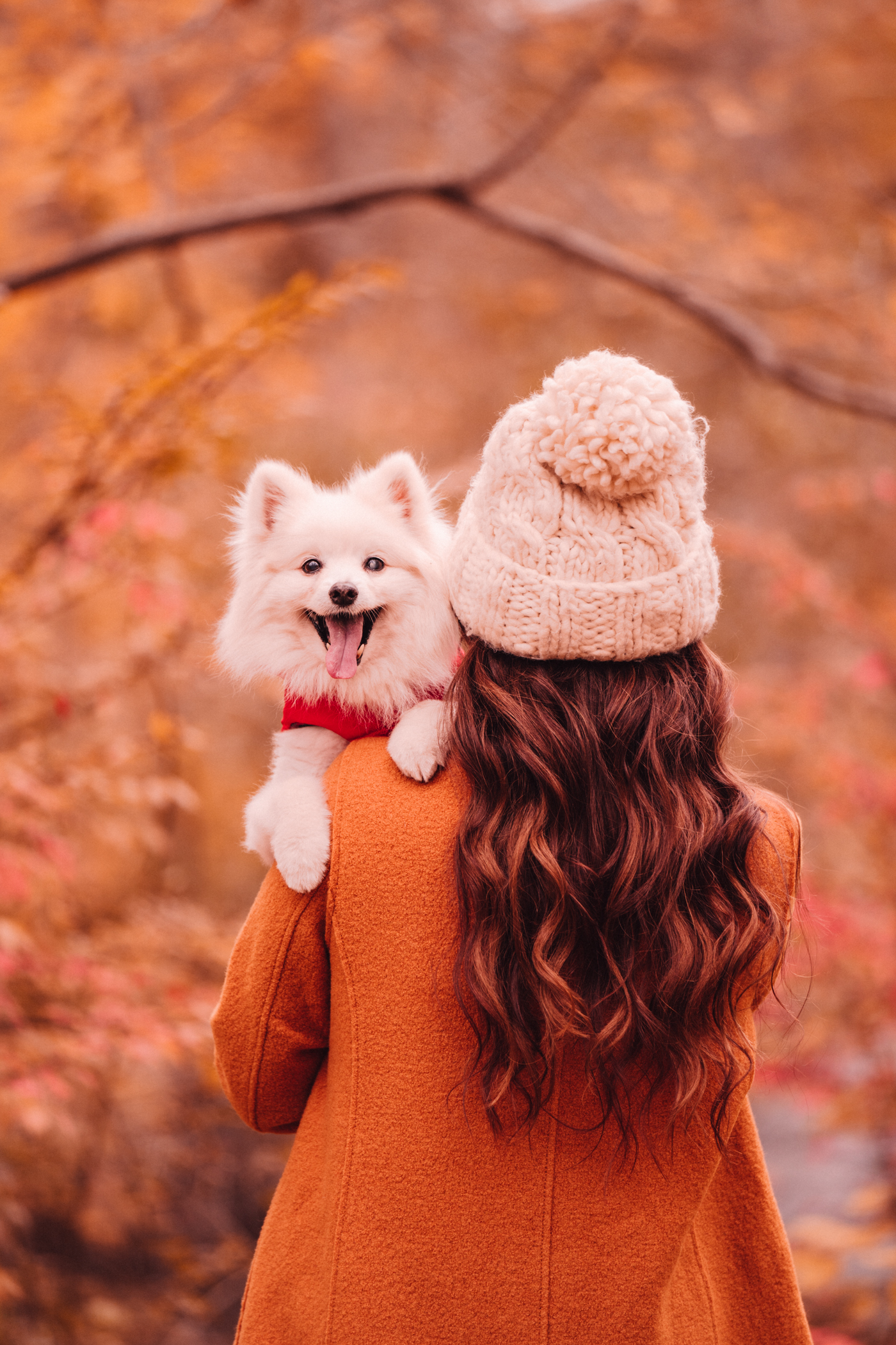 woman sharing Florals and Foliage and carrying her dog