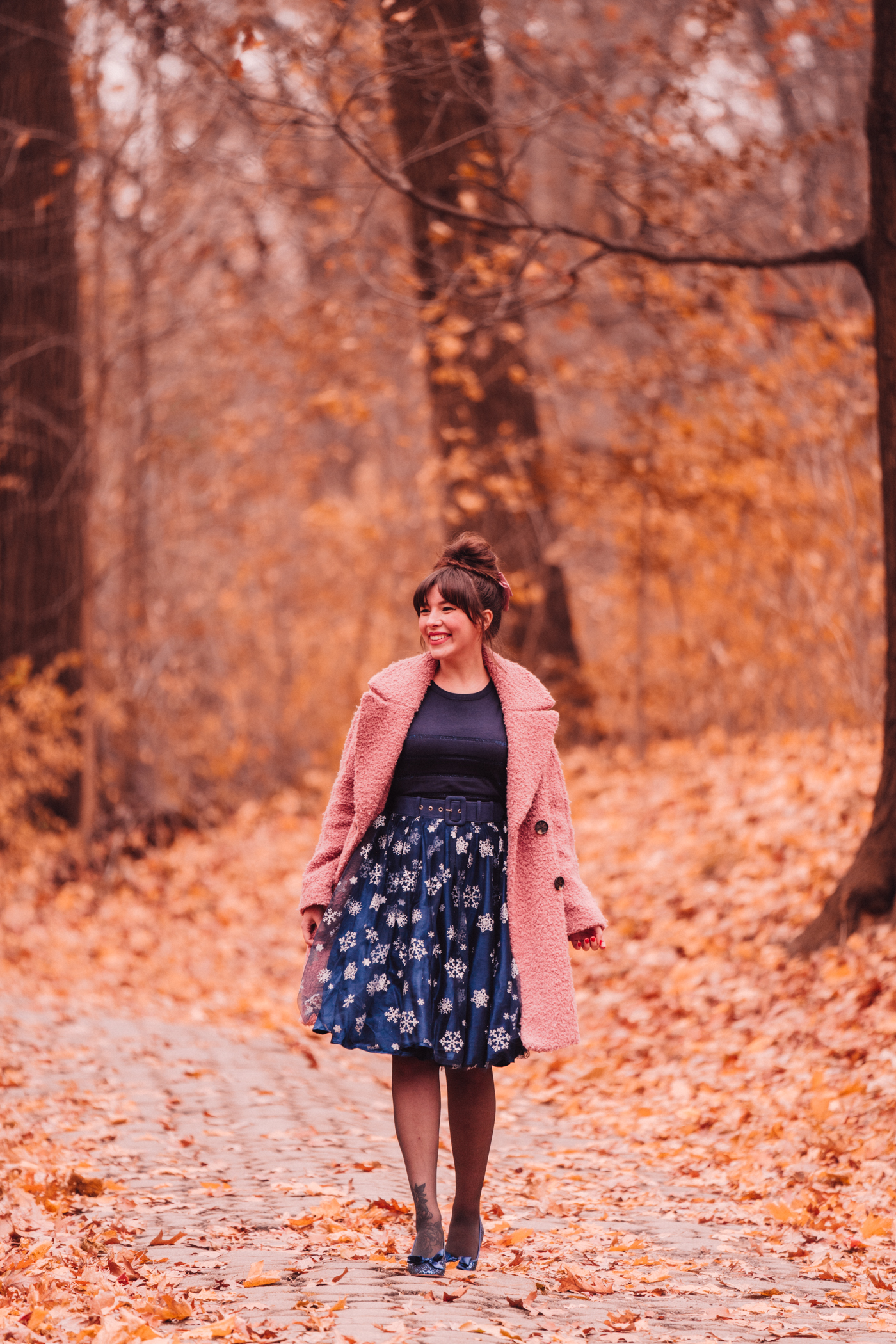 woman wearing navy snowflake skirt