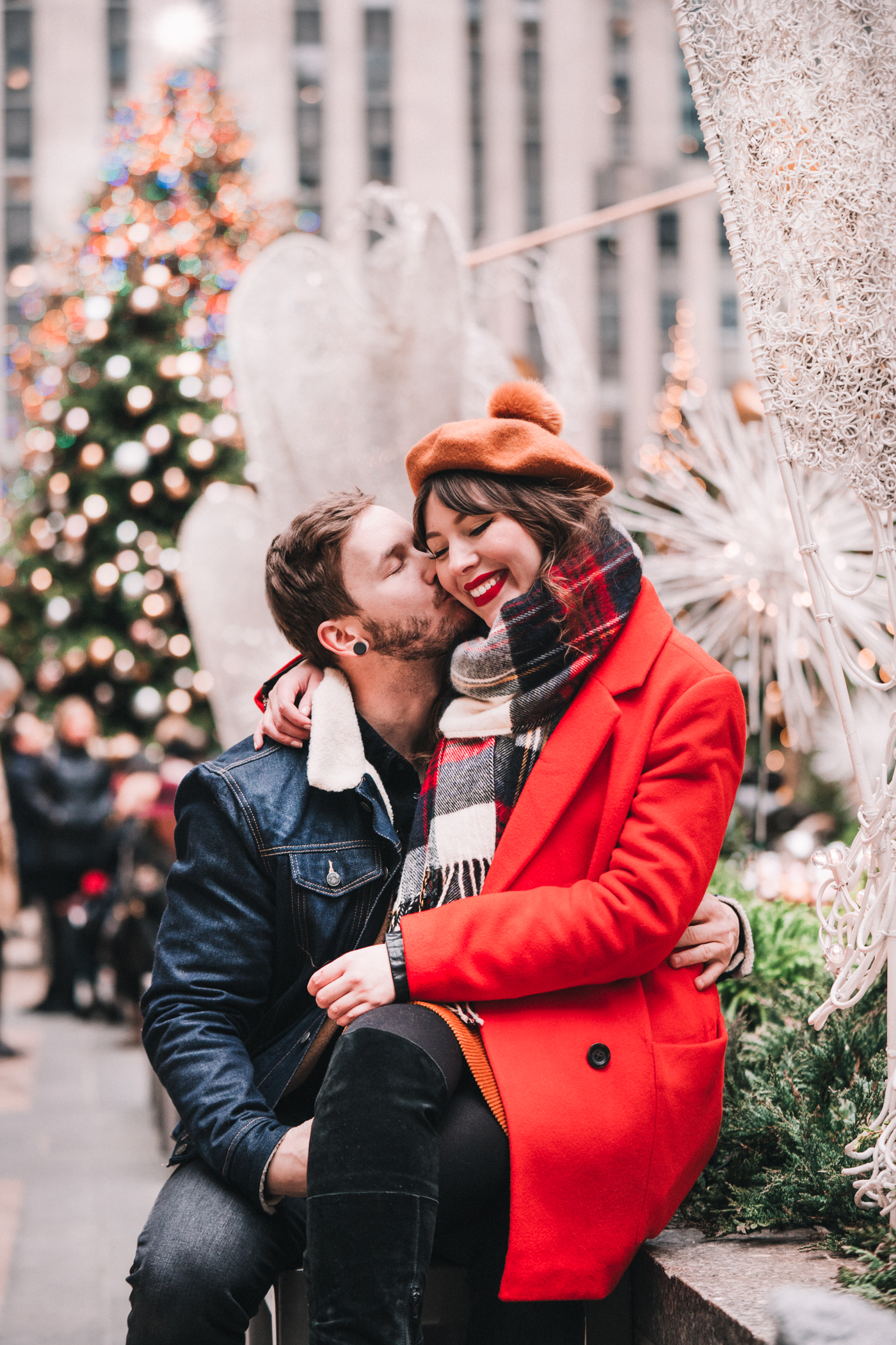 couple sitting and it's beginning to look a lot like Christmas