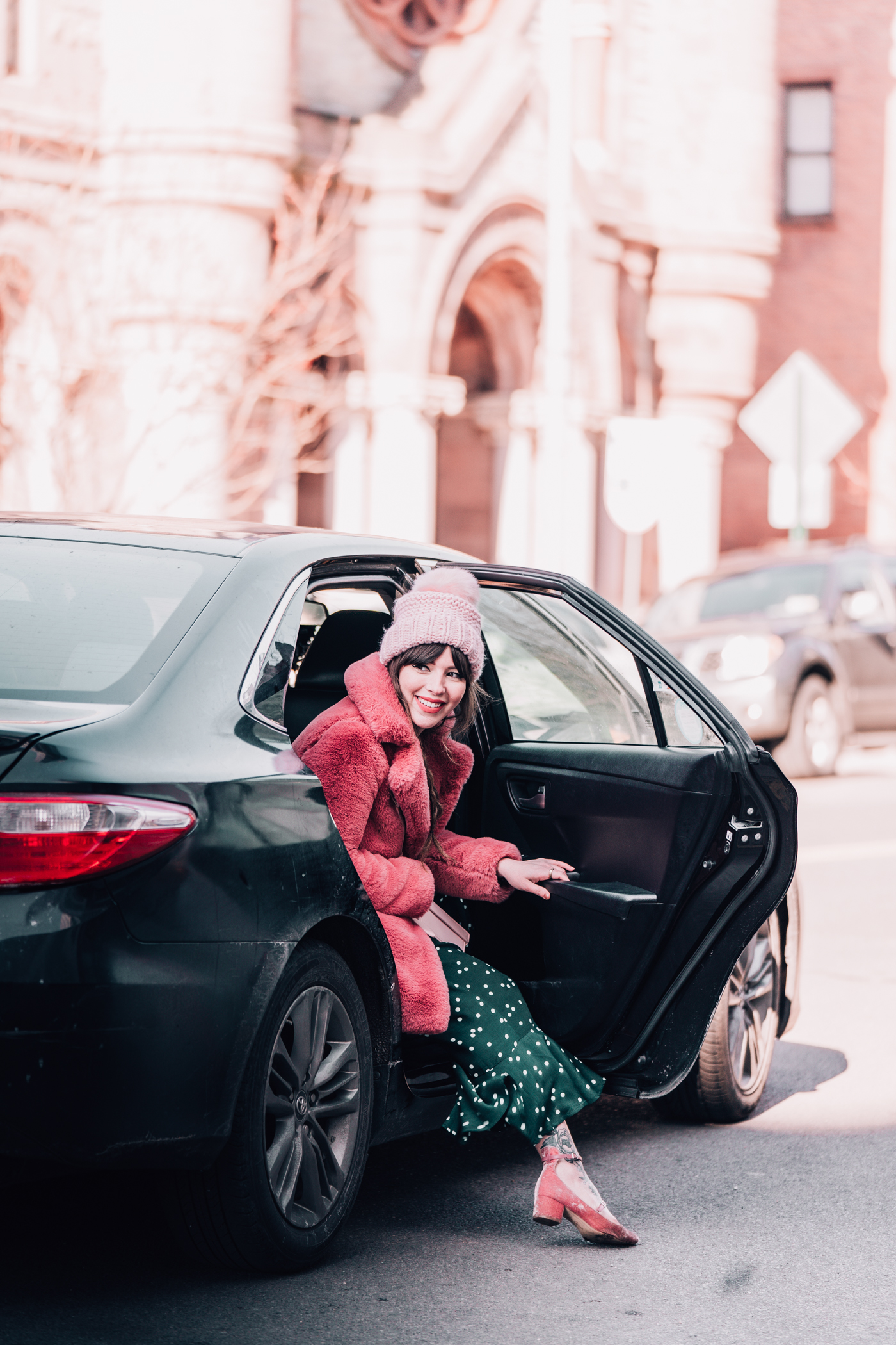 woman in a black car