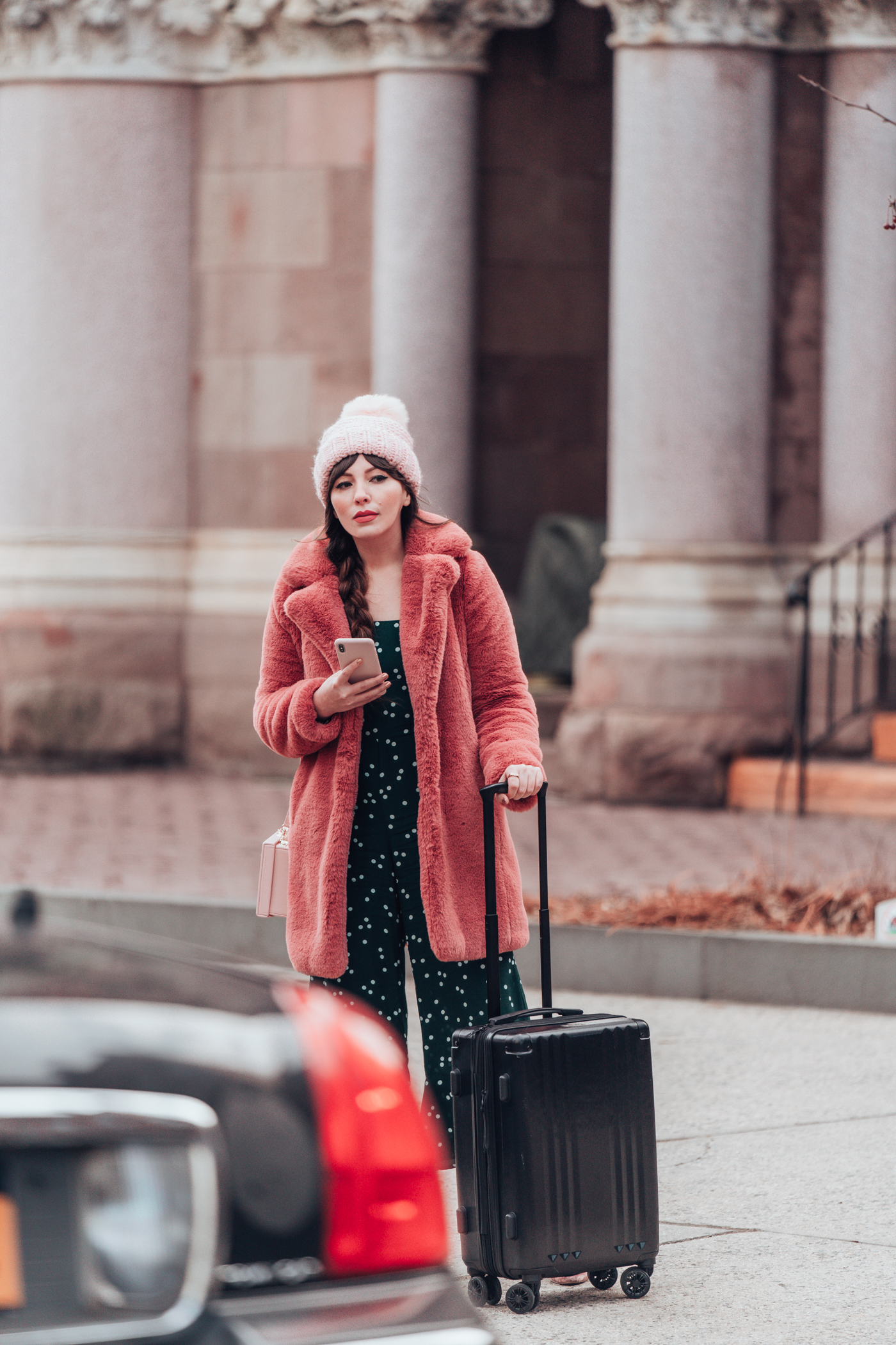 woman waiting for her ride from Uber Rewards