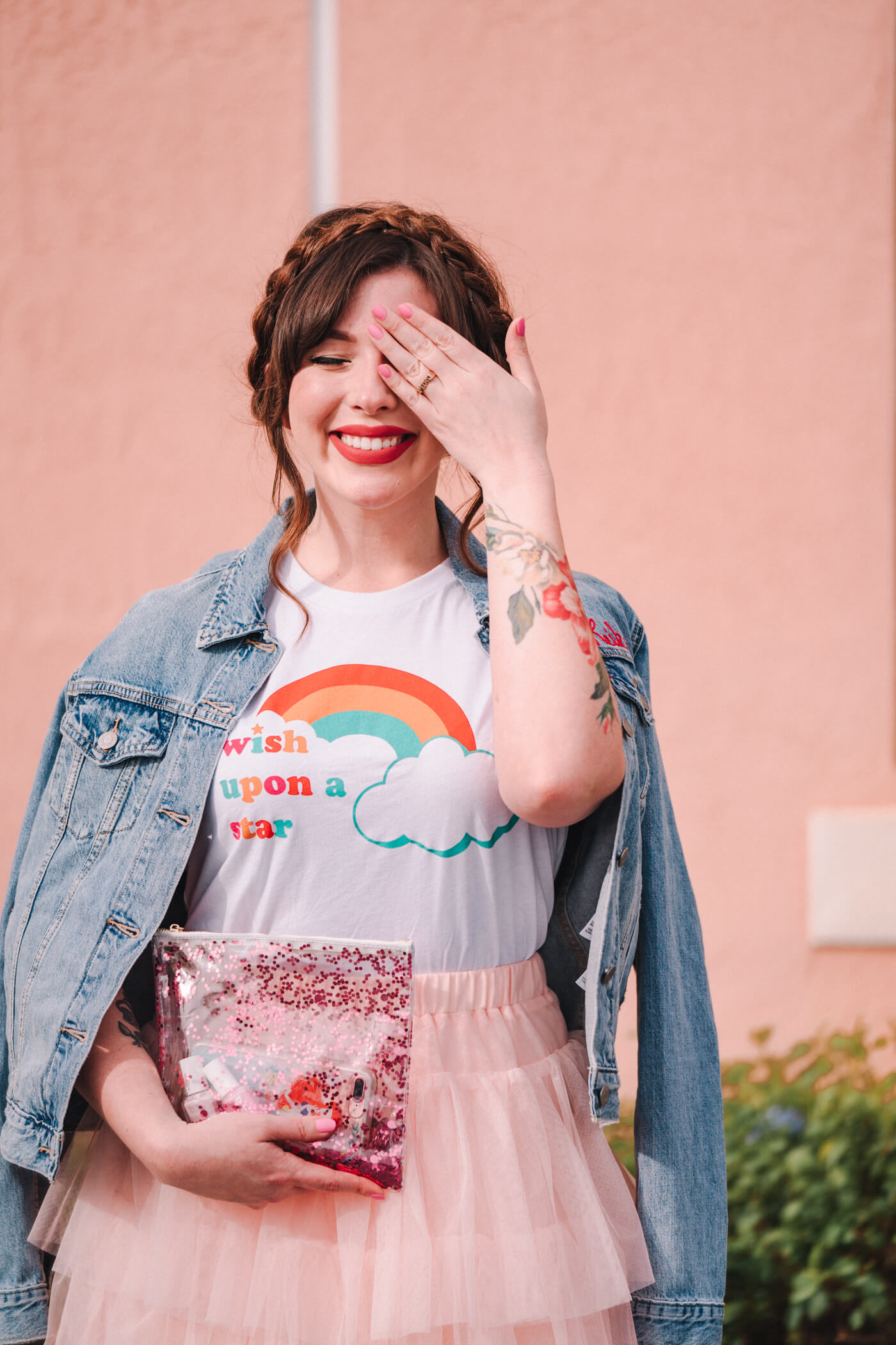 woman wearing Wish Upon a Star shirt and pink skirt