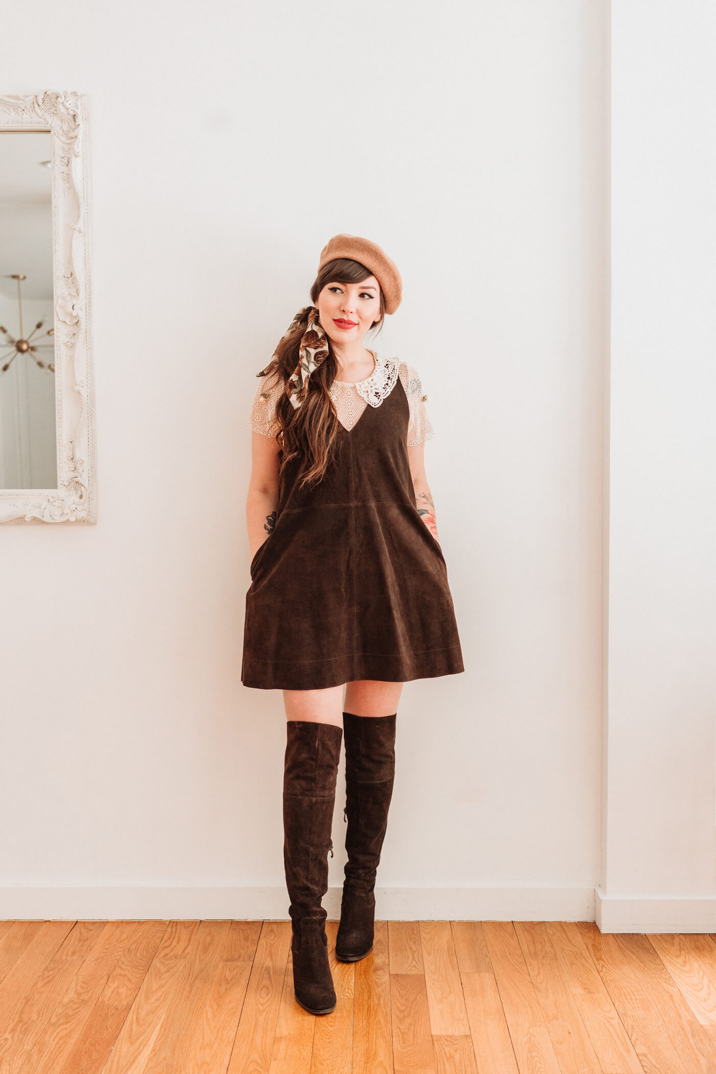 woman wearing brown dress and knee high boots 