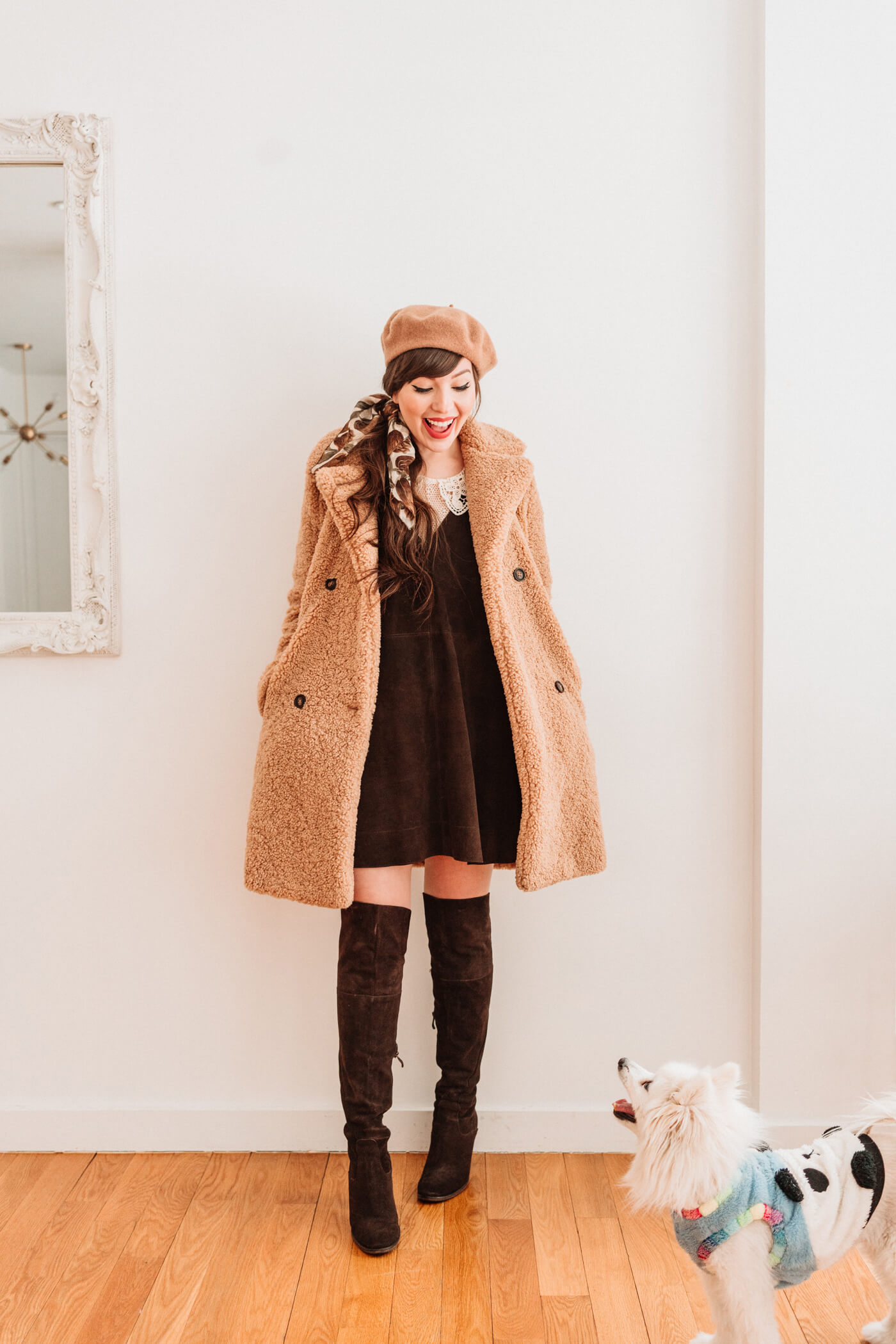 woman wearing brown dress and knee high boots and teddy coat