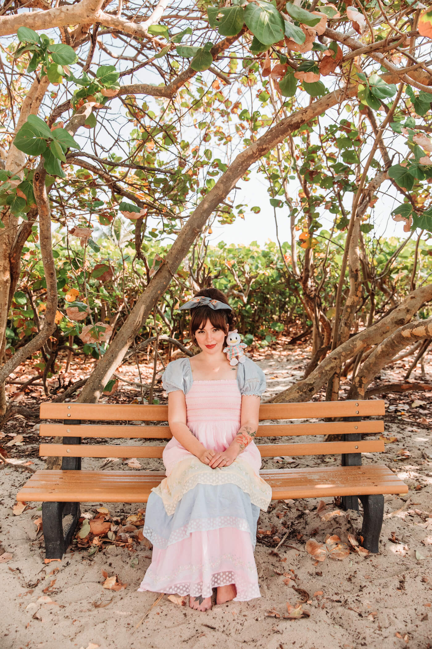 woman at the beach wearing pastel dress for nuiMOs Outfits