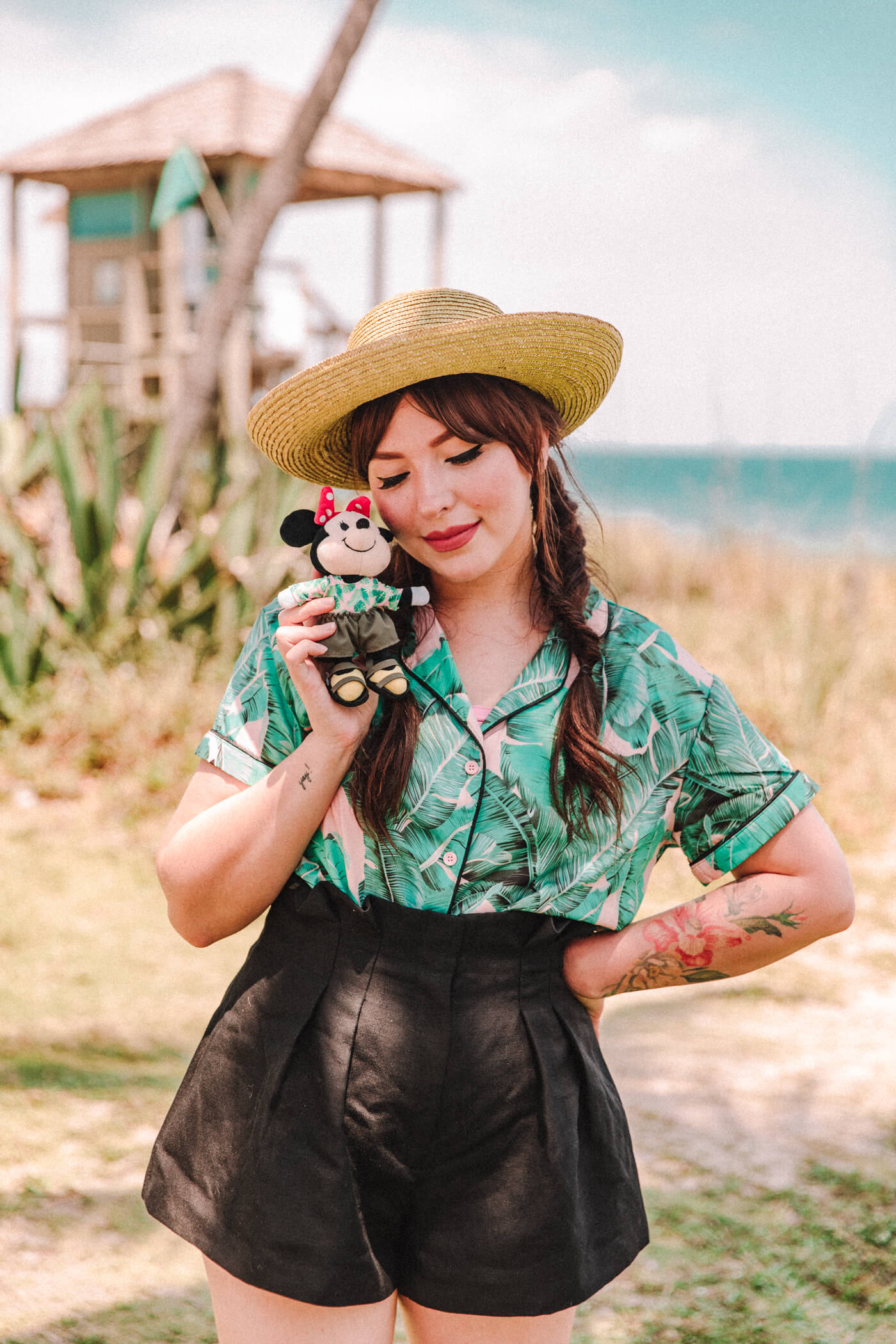 woman wearing green top and black shorts