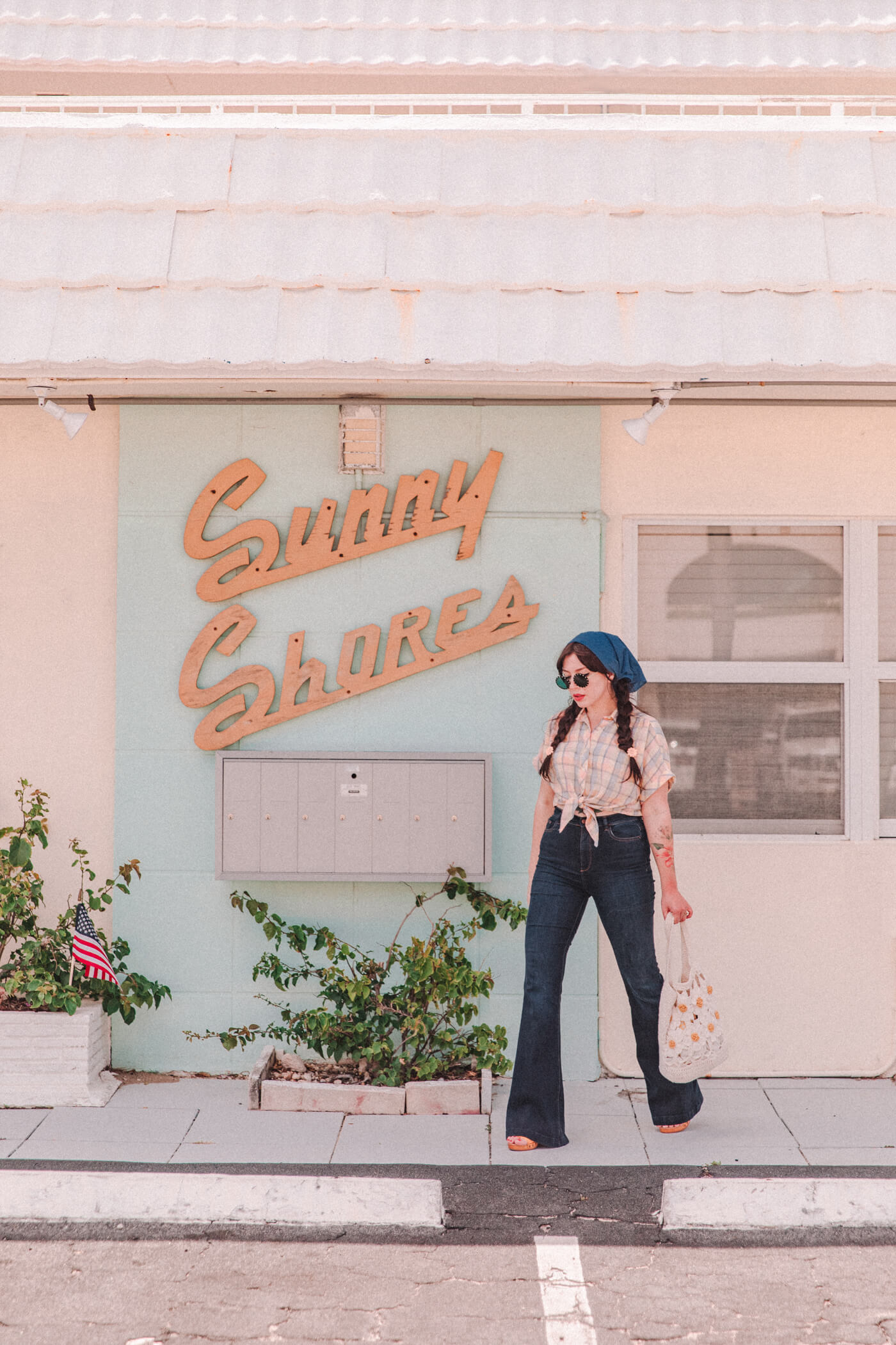 woman wearing bell bottom jeans and shirt