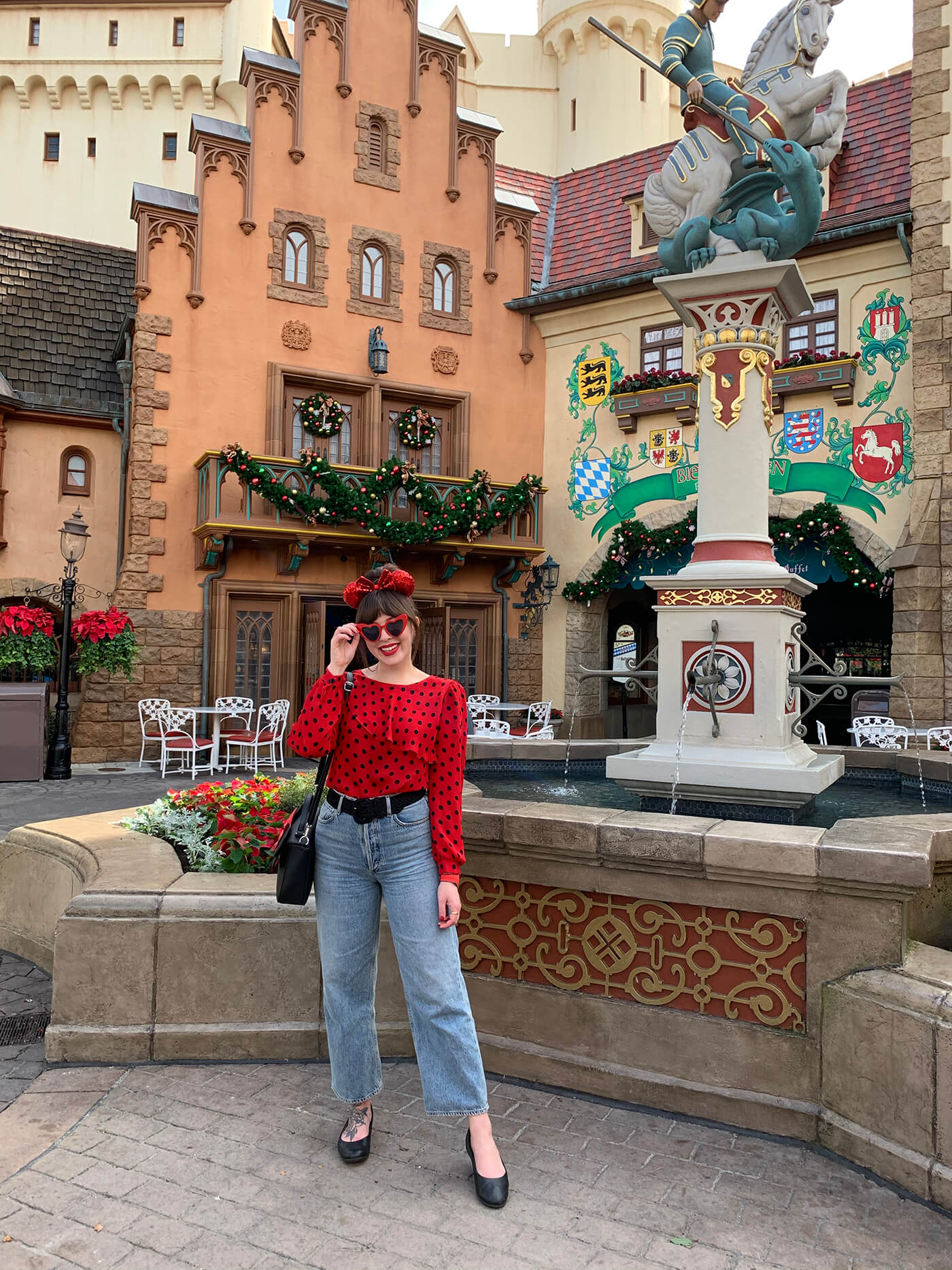 woman wearing red polka dot top and AGOLDE "Ren" Wide Leg Jeans one of her favorite brands and styles of jeans