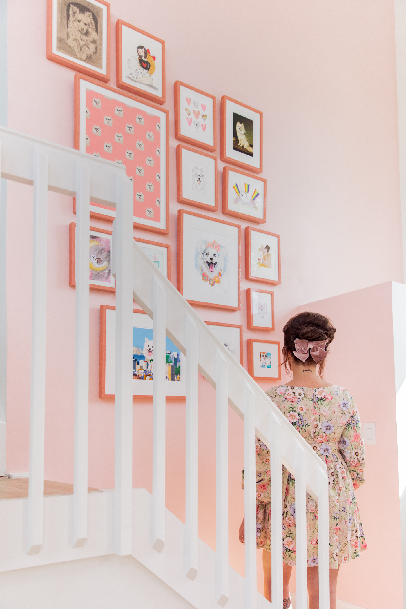 woman looking at her Gallery Wall with Framebridge