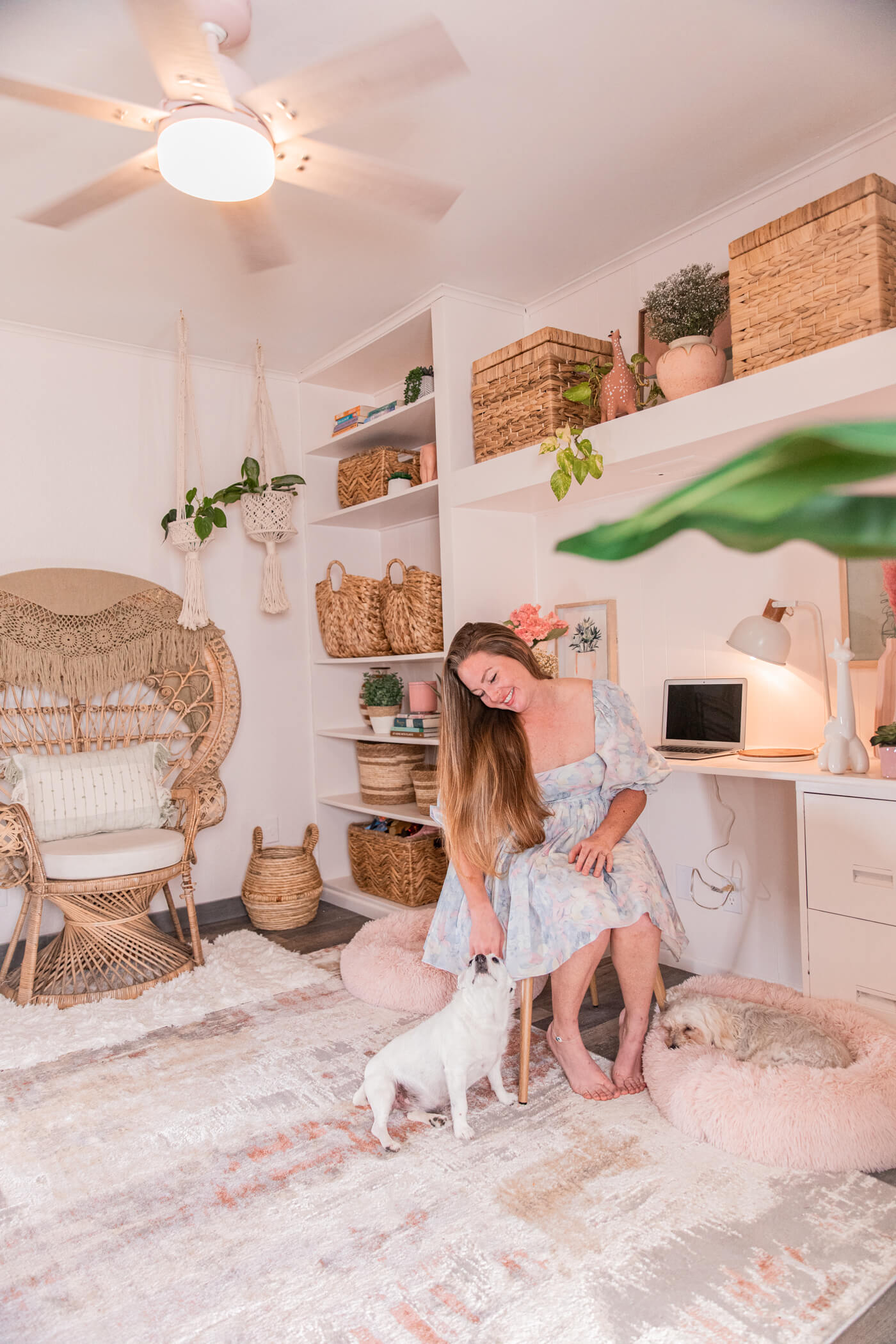 woman in her HomeGoods Pastel Bohemian Office Makeover with her dog 