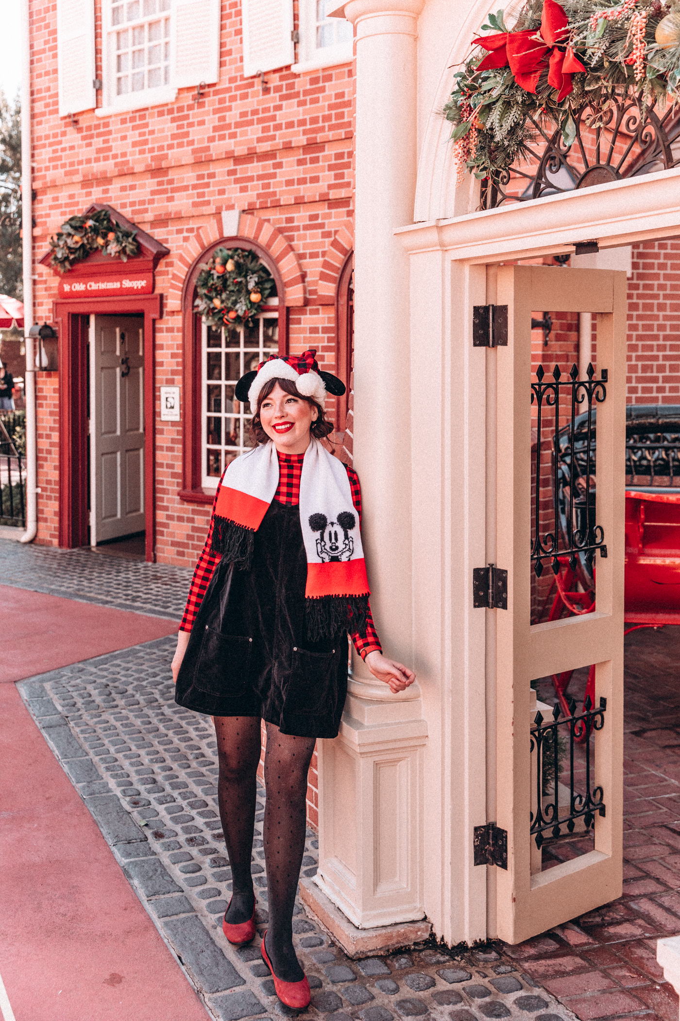 woman leaning and wearing Holiday Disney Outfits