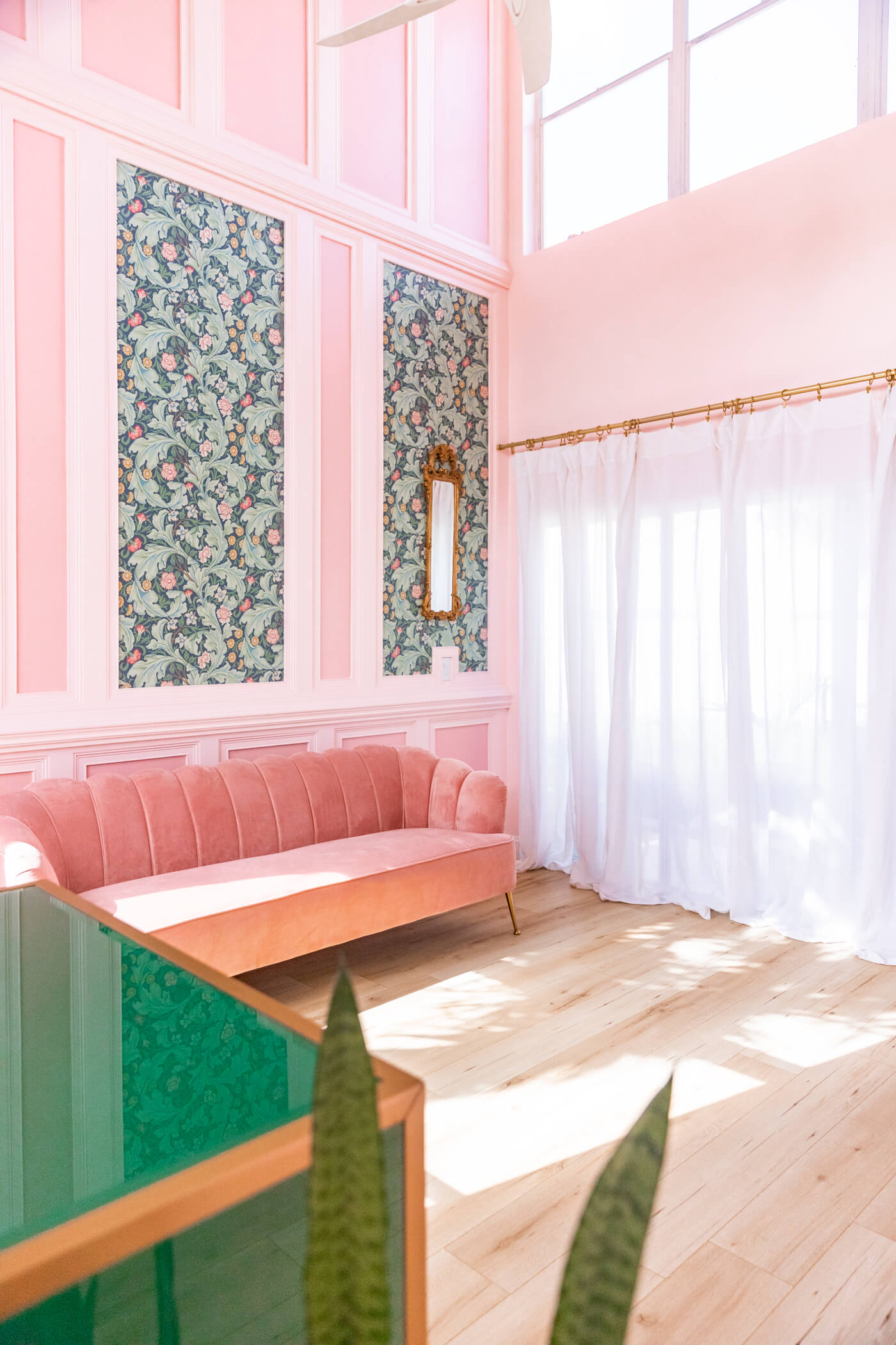 living room with pink velvet couch 