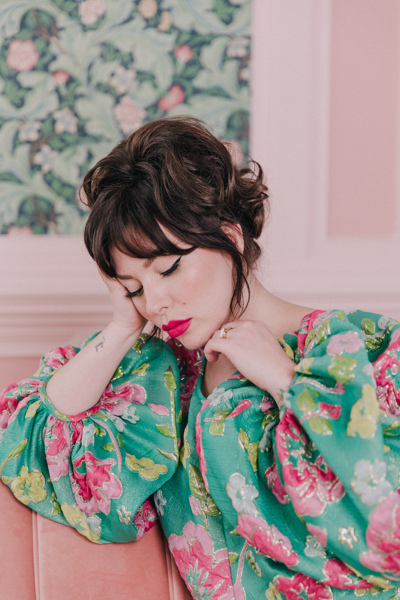 woman wearing green floral Good Luck Dress and updo hair