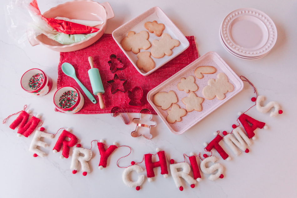 sugar cookie, cookie cutters, royal icing, and decor for a holiday party