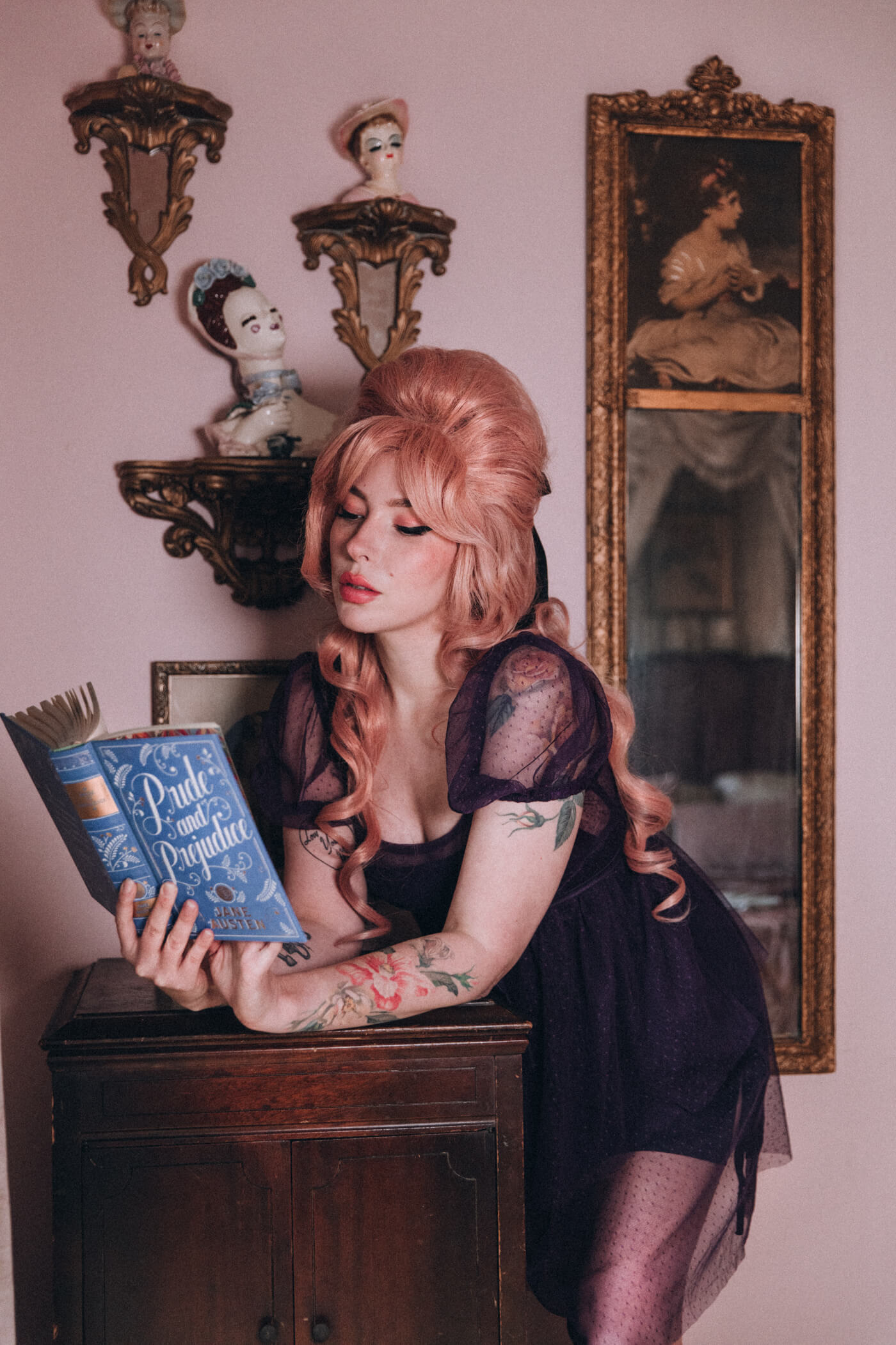 Evelyn Bourdon wearing a Most Ardently dress and reading Pride and Prejudice